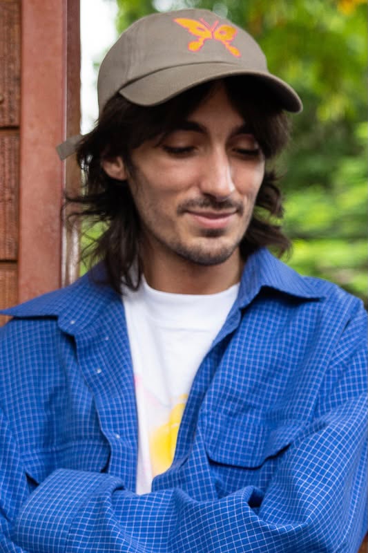 update prayer wearing a cap and blue shirt